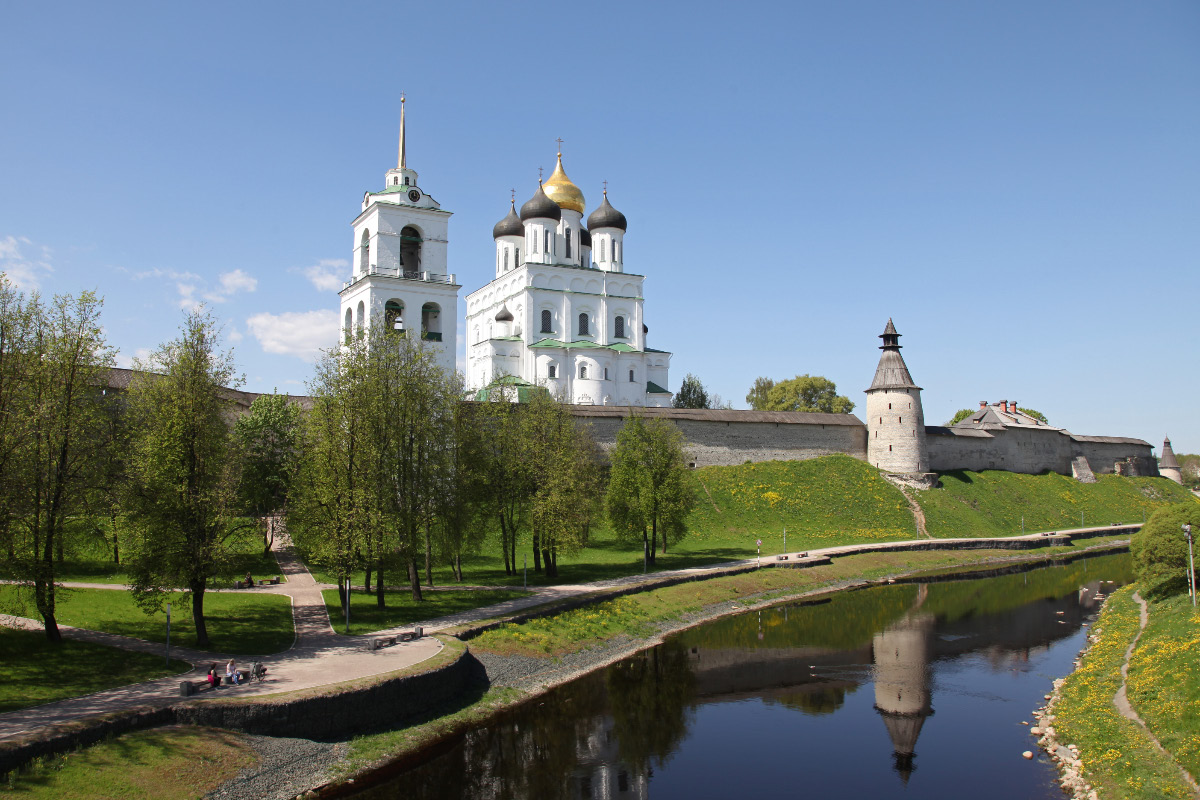 Trinity Cathedral and Belltower within the walls of the Pskov Krom (or Kremlin) along the banks of the Pskova River