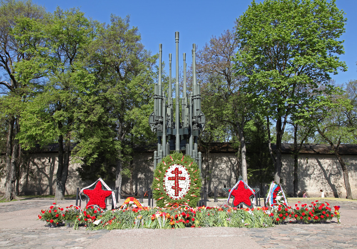 Orthodox Cross wreath and Communist stars celebrating a lie.